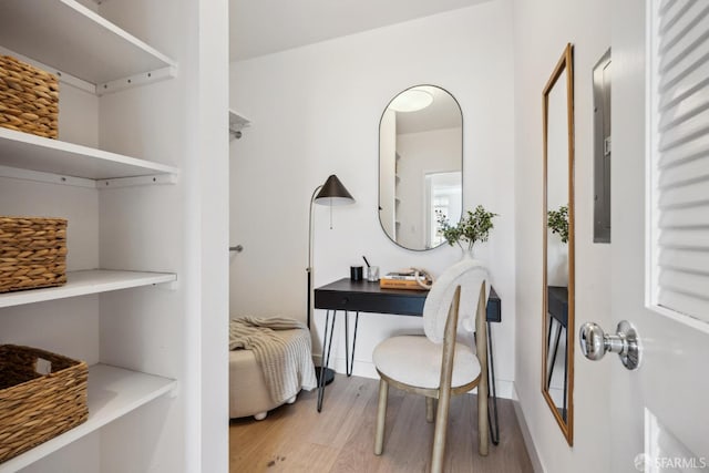 interior space with light wood-style floors and baseboards