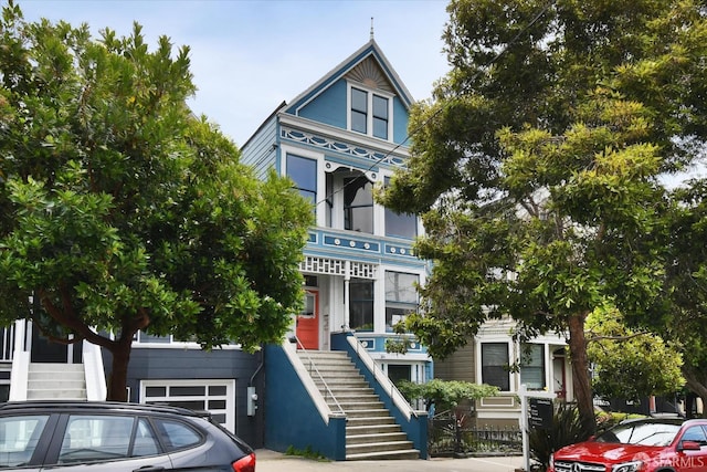 27 Hartford St, San Francisco, CA 94114 - victorian-style house with stairs and a garage