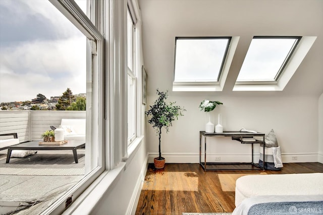 27 Hartford St, San Francisco, CA 94114 - bedroom featuring a skylight and wood finished floors