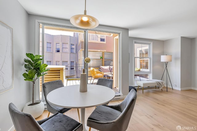 1734 Bay St Unit 103, San Francisco, CA 94123 - dining area featuring light wood-style floors and baseboards