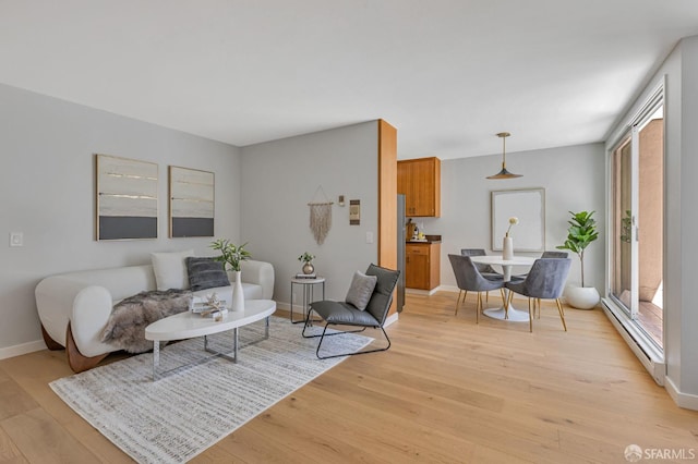 1734 Bay St Unit 103, San Francisco, CA 94123 - living area with a baseboard heating unit and light wood-style floors