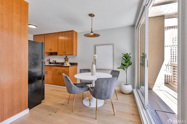 1734 Bay St Unit 103, San Francisco, CA 94123 - dining area featuring light wood-type flooring and baseboards