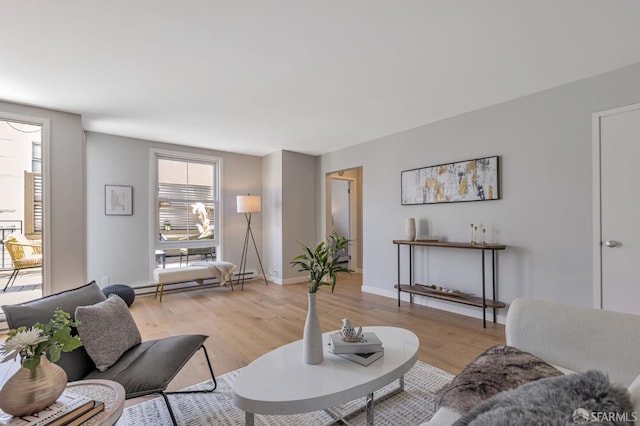 1734 Bay St Unit 103, San Francisco, CA 94123 - living room with baseboard heating and light wood-style floors