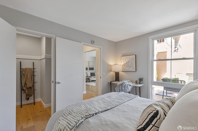 1734 Bay St Unit 103, San Francisco, CA 94123 - bedroom with light wood-style flooring and baseboards