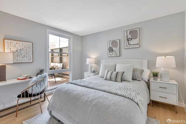 1734 Bay St Unit 103, San Francisco, CA 94123 - bedroom with light wood-type flooring and baseboards