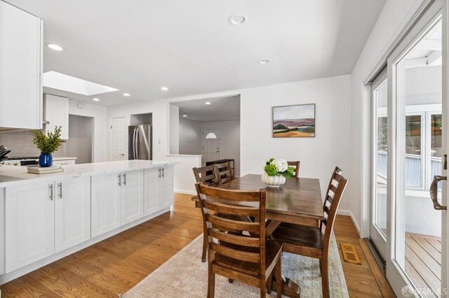 744 Crompton Rd, Redwood City, CA 94061 - dining space featuring light wood finished floors, a skylight, and recessed lighting