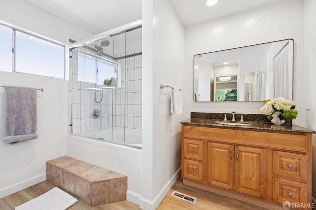 744 Crompton Rd, Redwood City, CA 94061 - bathroom featuring vanity, wood finished floors, enclosed tub / shower combo, and recessed lighting
