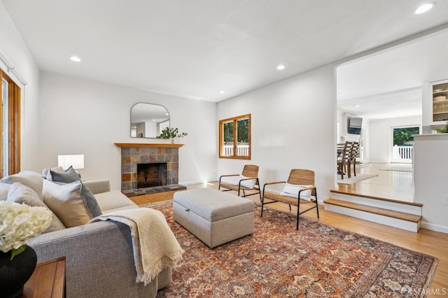 744 Crompton Rd, Redwood City, CA 94061 - living area with wood finished floors, a tiled fireplace, and recessed lighting