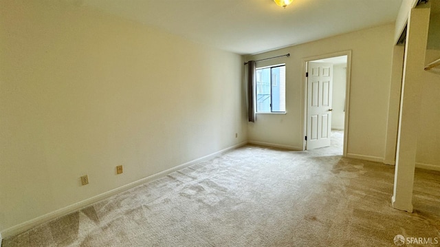 unfurnished bedroom with light carpet