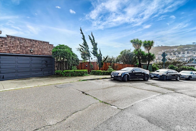 view of car parking with fence