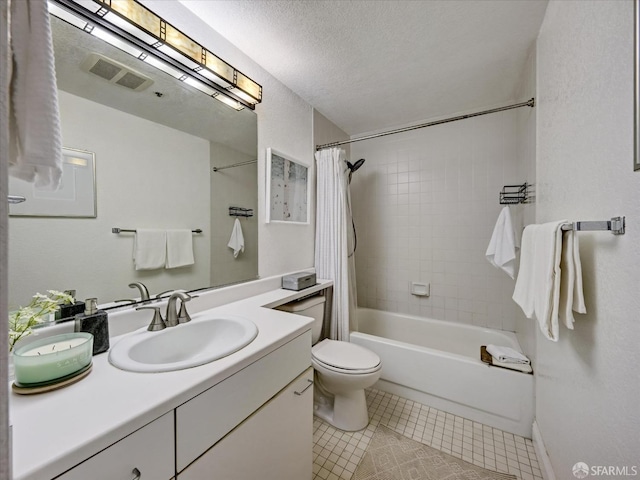 full bathroom featuring shower / bathtub combination with curtain, tile patterned floors, a textured ceiling, toilet, and vanity