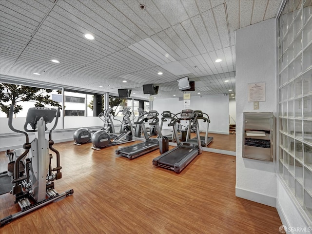 workout area with wood-type flooring