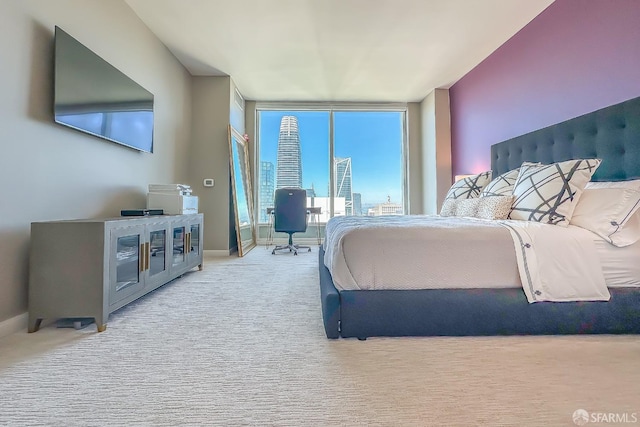 bedroom featuring light colored carpet