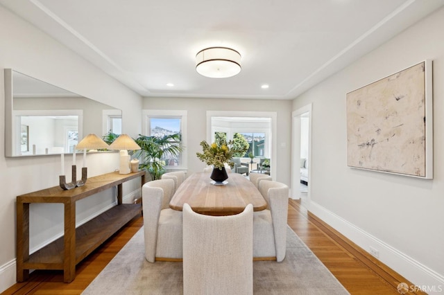 dining area featuring recessed lighting, baseboards, and wood finished floors