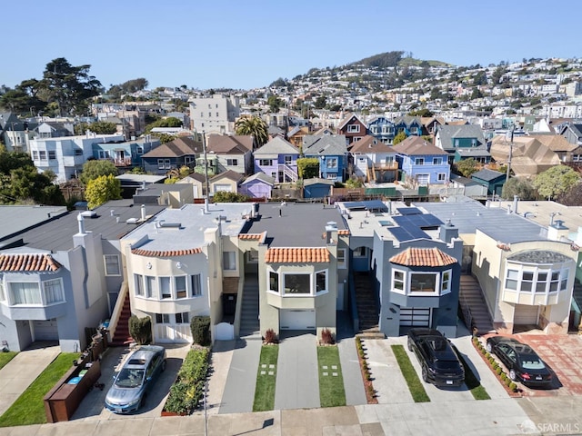 birds eye view of property with a residential view