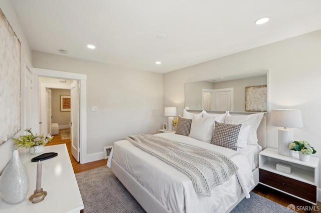 bedroom featuring recessed lighting, visible vents, baseboards, and wood finished floors