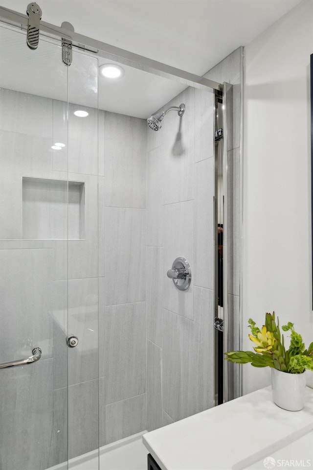 full bath featuring a shower stall