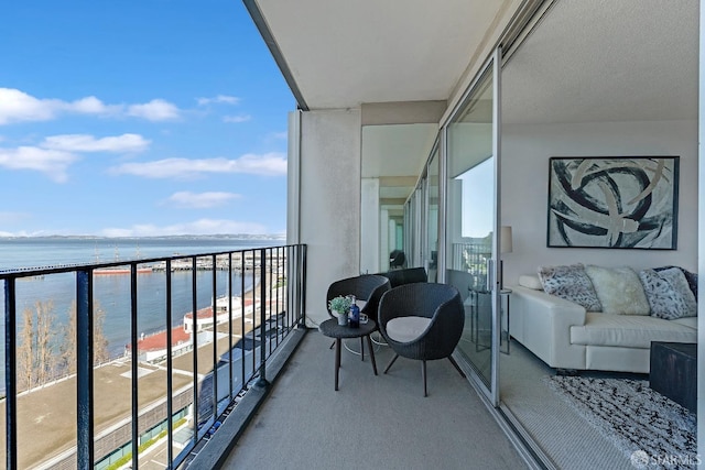 balcony featuring a water view