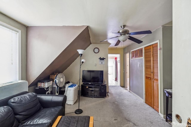 living room with ceiling fan and light colored carpet