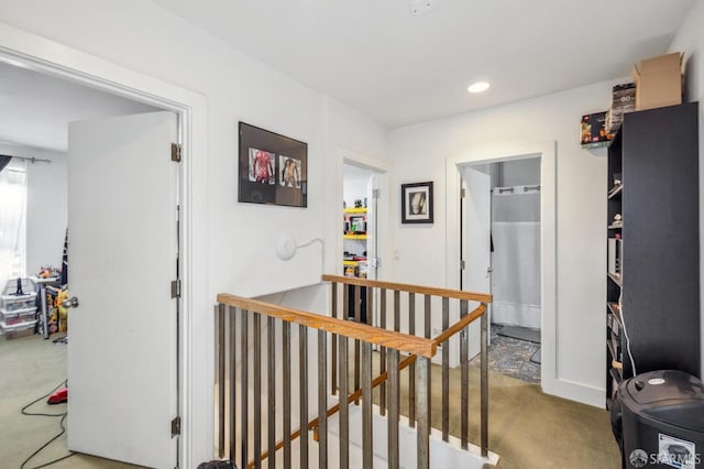 hallway with carpet flooring