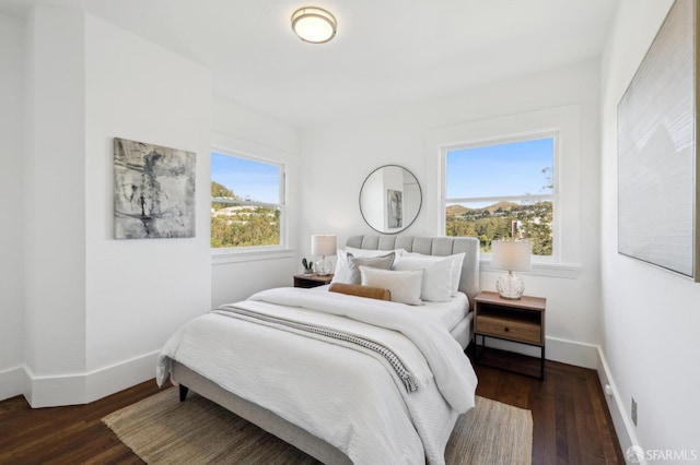 bedroom featuring dark hardwood / wood-style flooring