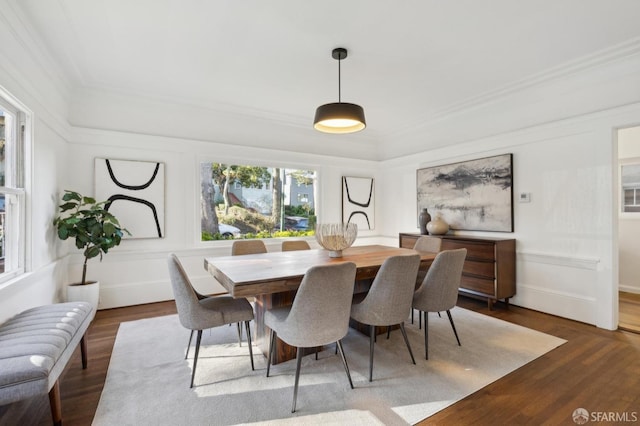 dining room featuring ornamental molding and wood-type flooring