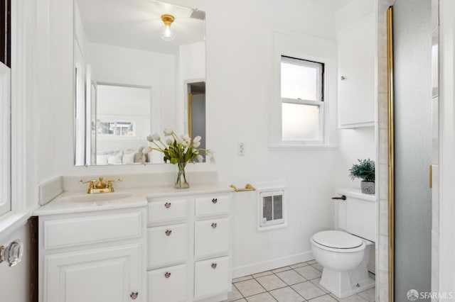 bathroom featuring tile patterned floors, toilet, and vanity