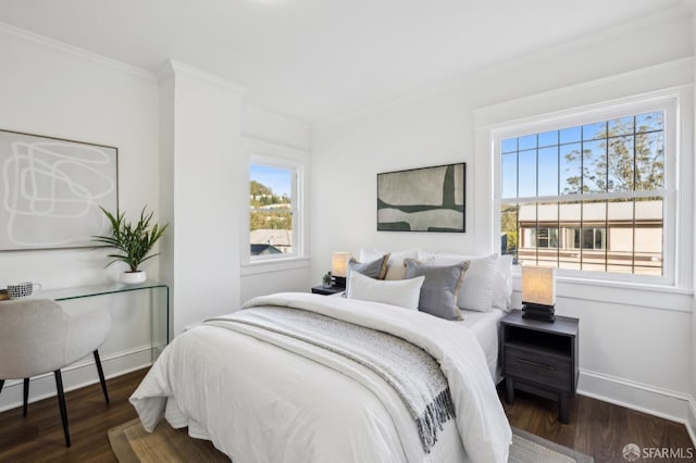 bedroom with dark wood-type flooring and crown molding