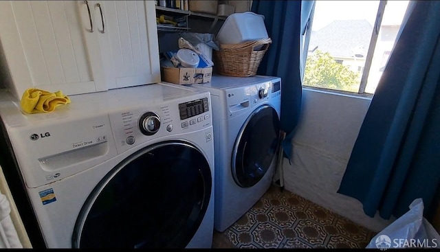 laundry area with washing machine and dryer and laundry area