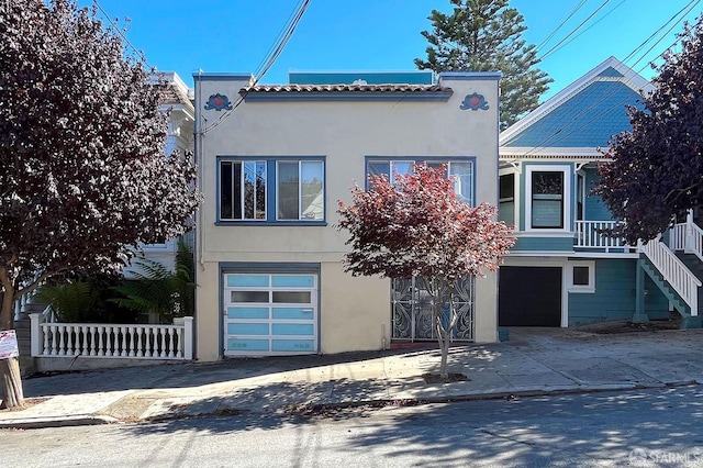 mediterranean / spanish house with a garage