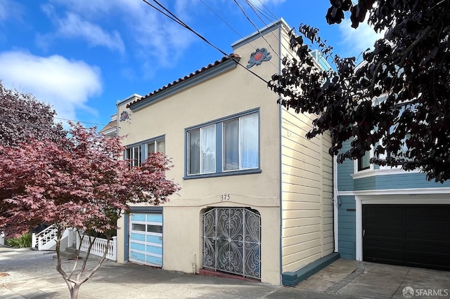 view of side of property featuring a garage