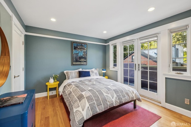 bedroom featuring recessed lighting, light wood-style flooring, and baseboards