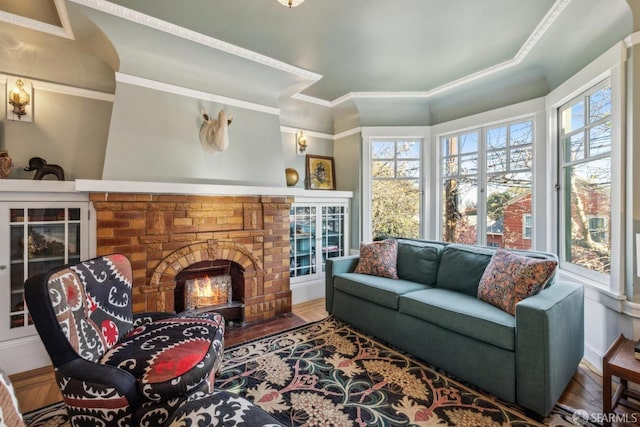 living area with a fireplace with flush hearth