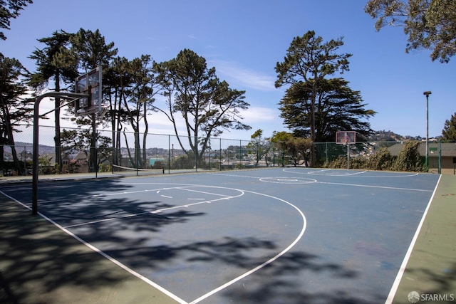 view of sport court with community basketball court and fence