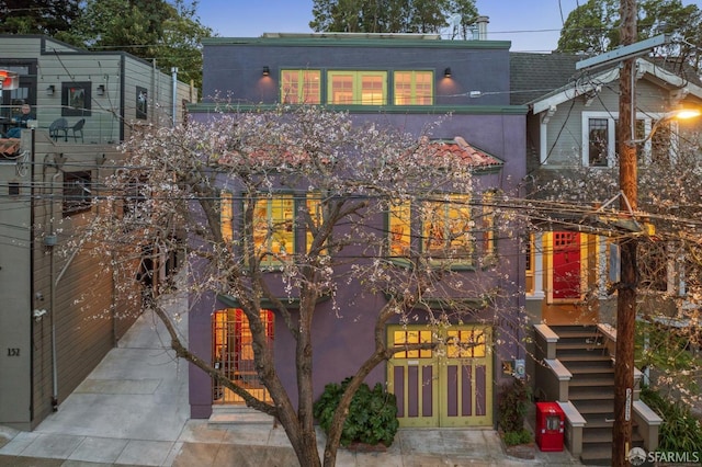 view of front of house featuring stucco siding