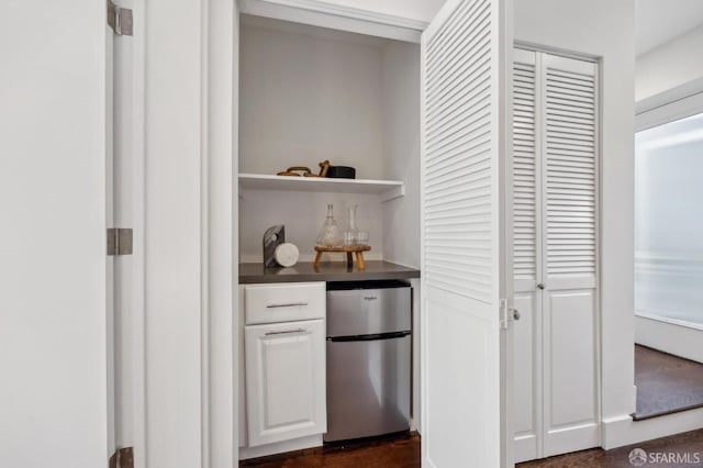 indoor dry bar with freestanding refrigerator