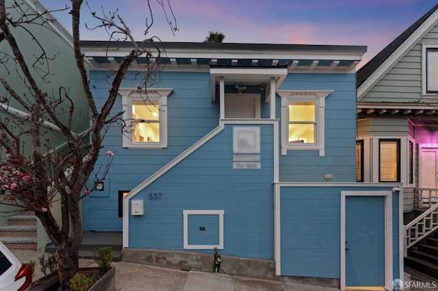 back of property with stairway
