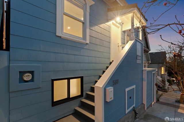 view of property exterior featuring stairs