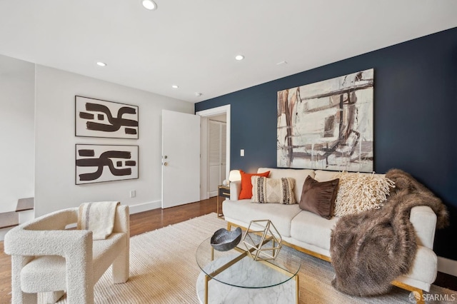 living area featuring recessed lighting, wood finished floors, and baseboards