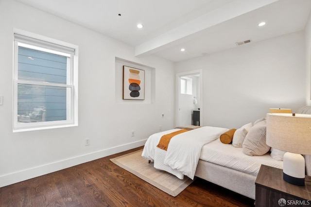 bedroom with baseboards, dark wood-type flooring, recessed lighting, and beamed ceiling