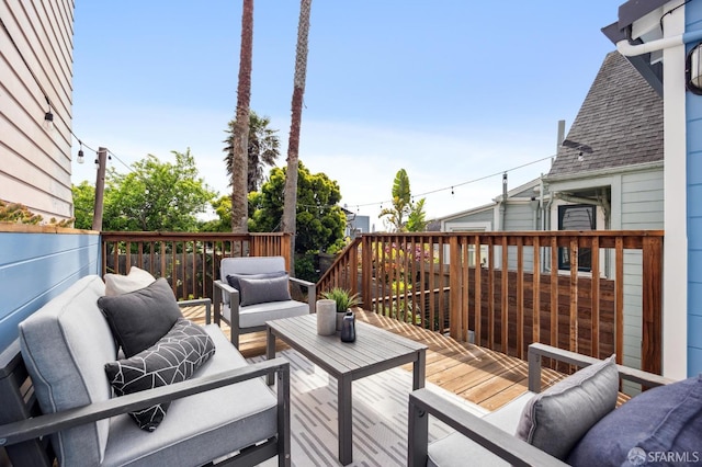 wooden deck featuring outdoor lounge area