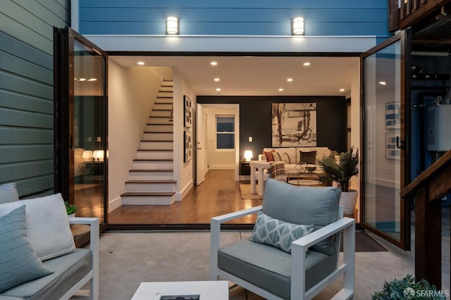 view of exterior entry with outdoor lounge area