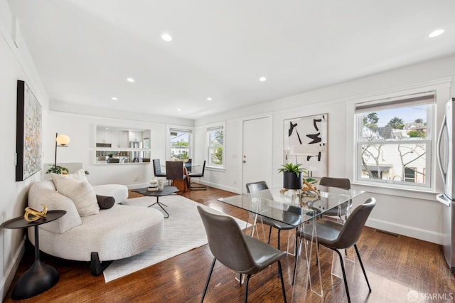 dining area with baseboards, recessed lighting, and wood finished floors