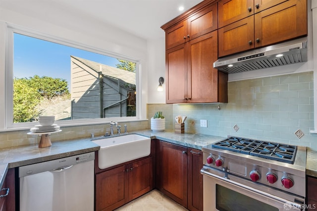 kitchen with sink, backsplash, light stone counters, exhaust hood, and stainless steel appliances