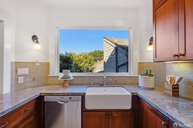 kitchen featuring sink, stainless steel dishwasher, tasteful backsplash, and light stone counters