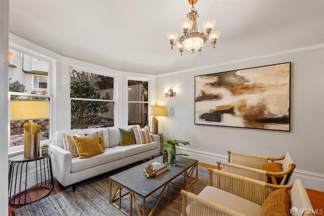 living room with hardwood / wood-style flooring and a notable chandelier