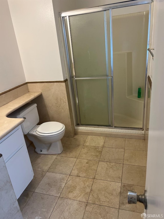 2113 Mandarin Way, Antioch, CA 94509 - bathroom featuring vanity, toilet, a wainscoted wall, and a stall shower