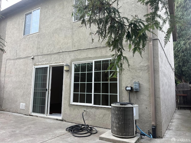 2113 Mandarin Way, Antioch, CA 94509 - back of house featuring stucco siding, fence, a patio area, and central air condition unit