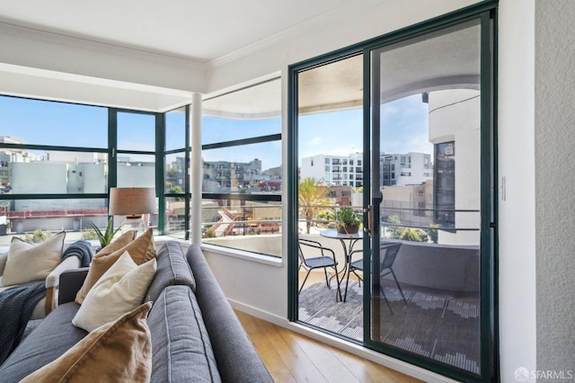 interior space featuring crown molding and hardwood / wood-style flooring