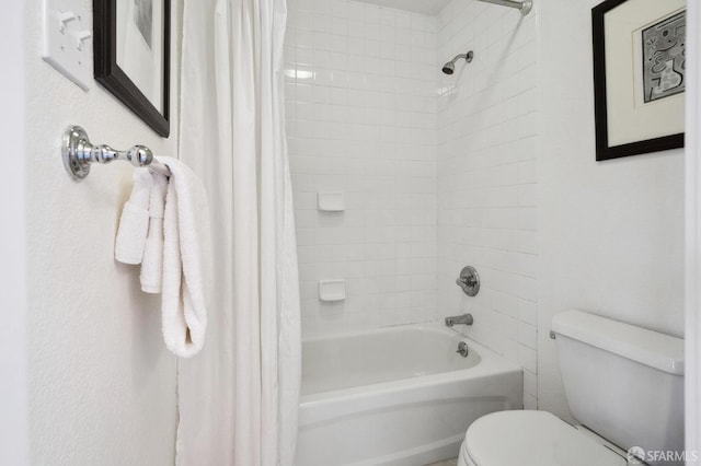 bathroom with toilet and shower / bath combination with curtain